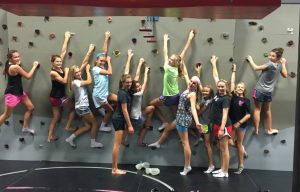 Girls On Rock Wall At The Athletic Training Center